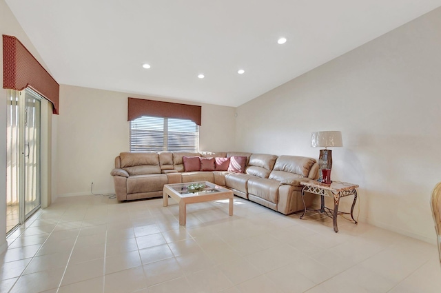 living room with lofted ceiling and light tile patterned flooring