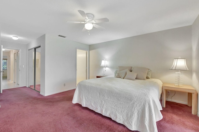 bedroom featuring carpet, a closet, and ceiling fan