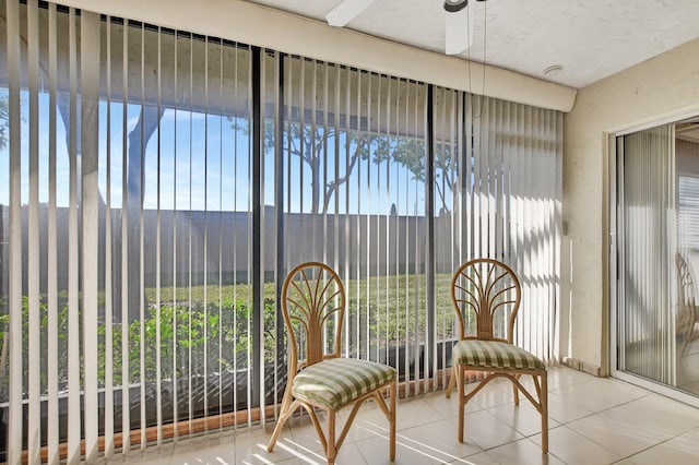 sunroom / solarium with ceiling fan