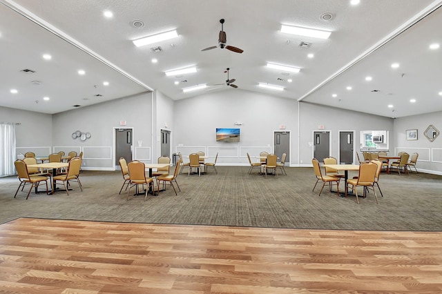 interior space with light hardwood / wood-style flooring, vaulted ceiling, and ceiling fan