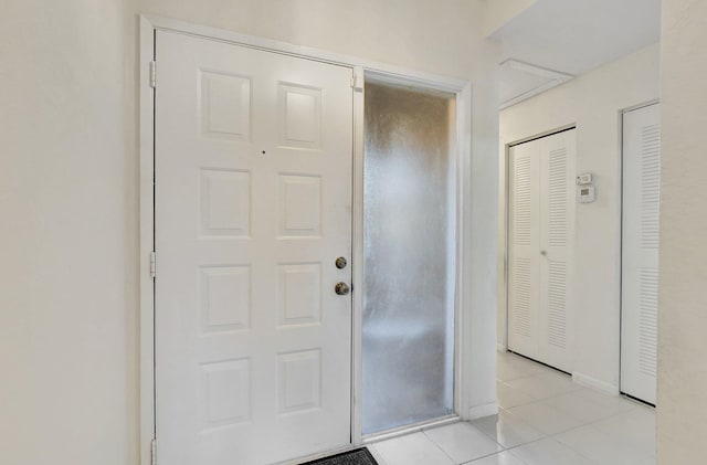 foyer featuring light tile patterned floors