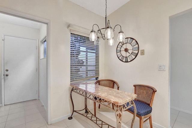 tiled dining space featuring vaulted ceiling