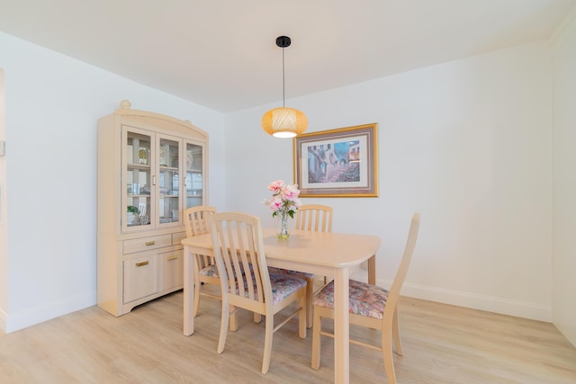 dining space featuring light wood-type flooring