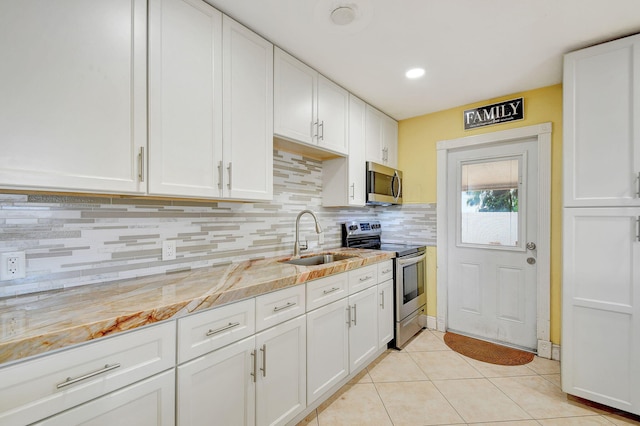 kitchen with white cabinets, sink, and stainless steel appliances