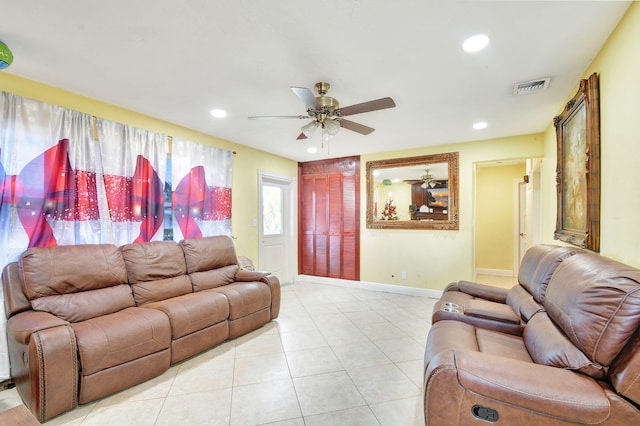 living room featuring ceiling fan and light tile patterned floors