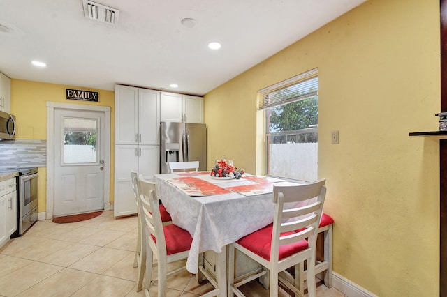 dining space with light tile patterned floors