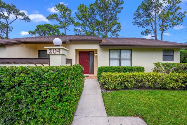 view of front of property with a front lawn