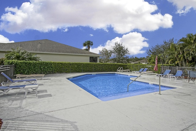 view of swimming pool featuring a patio