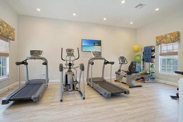 exercise room featuring light hardwood / wood-style flooring