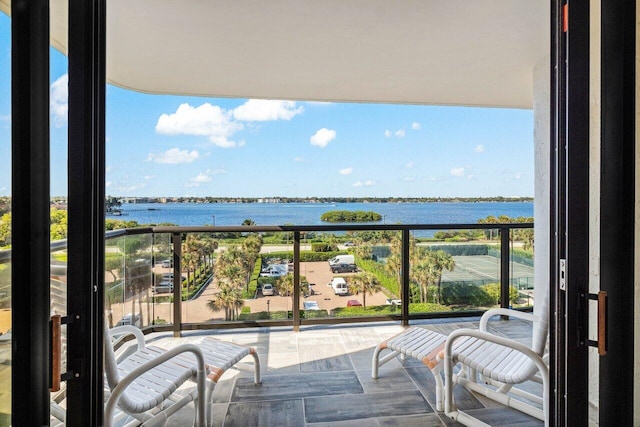 balcony featuring a water view