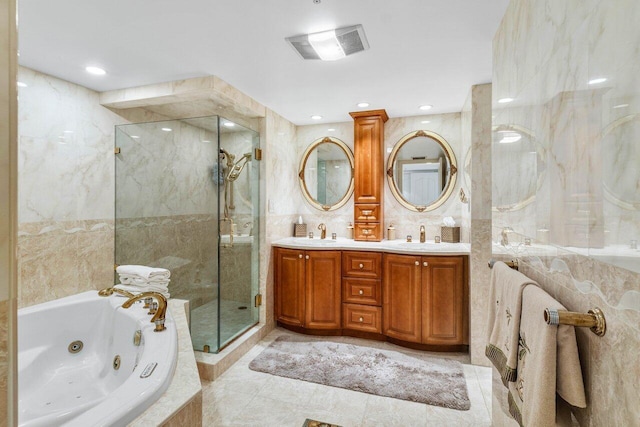 bathroom featuring vanity, shower with separate bathtub, and tile walls