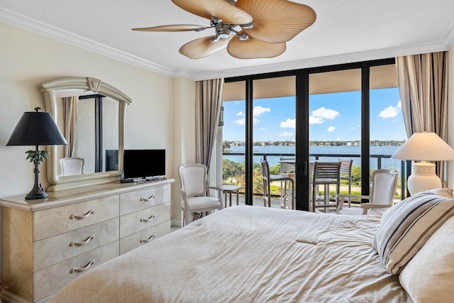 bedroom featuring access to exterior, ceiling fan, crown molding, and floor to ceiling windows