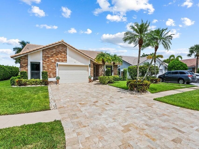 ranch-style house featuring a garage and a front yard