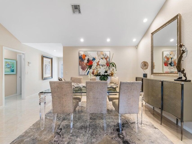 dining room with lofted ceiling