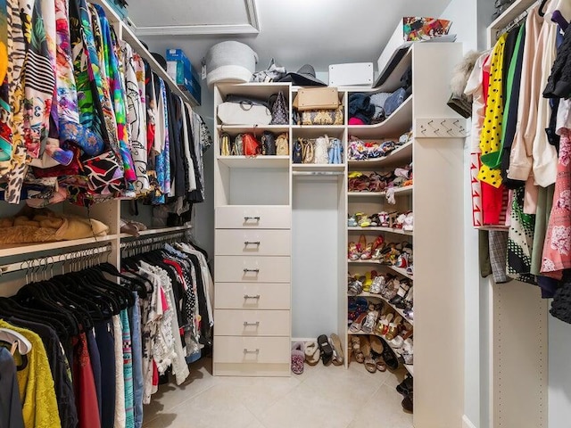 walk in closet featuring light tile patterned floors