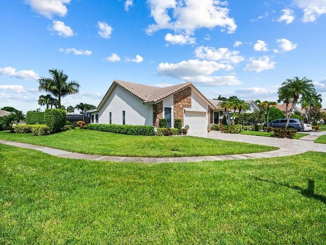 view of home's exterior with a yard and a garage