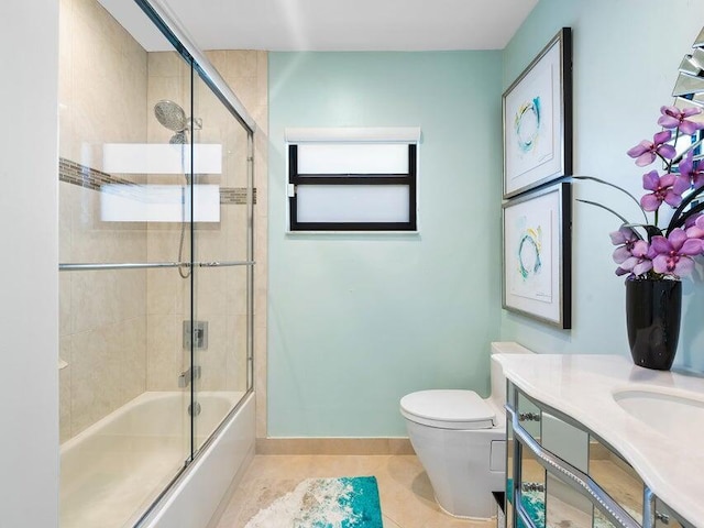 full bathroom with tile patterned floors, vanity, toilet, and enclosed tub / shower combo