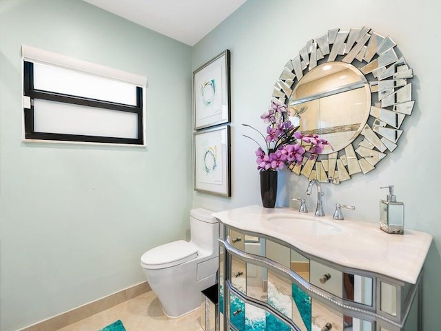 bathroom featuring tile patterned floors, vanity, and toilet