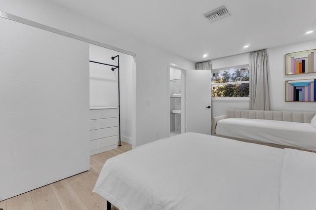 bedroom featuring light hardwood / wood-style floors