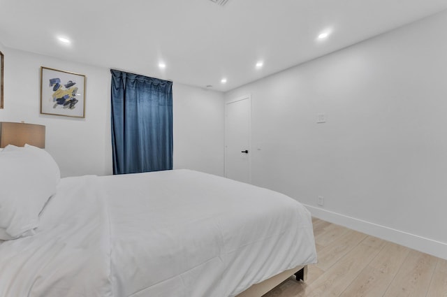 bedroom with light hardwood / wood-style flooring