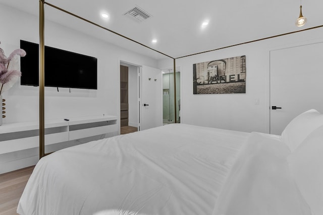 bedroom with light wood-type flooring