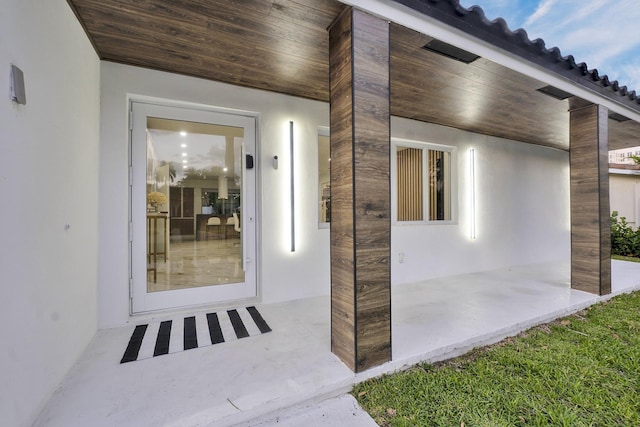 doorway to property featuring a patio area