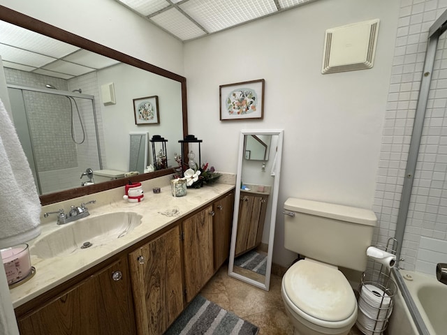 bathroom featuring tile patterned flooring, vanity, and toilet