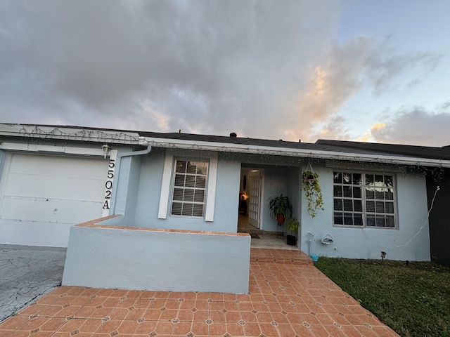 ranch-style house featuring a garage