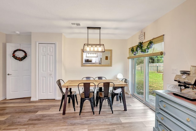 dining space featuring light hardwood / wood-style flooring