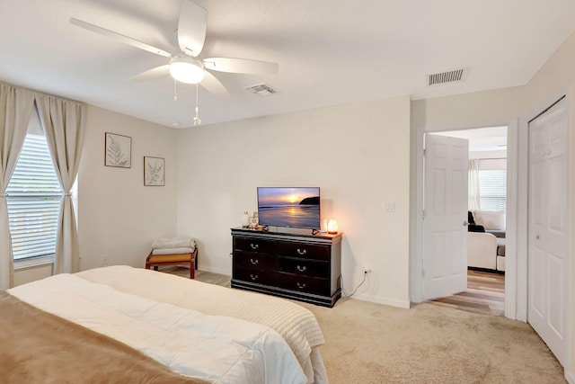 carpeted bedroom with ceiling fan