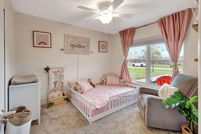 bedroom featuring ceiling fan and light colored carpet