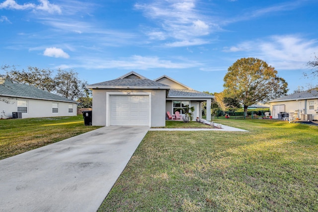 ranch-style house with a front yard and central air condition unit