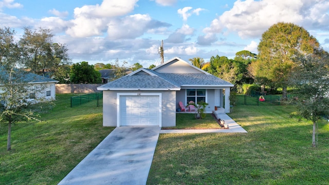 single story home featuring a garage and a front yard