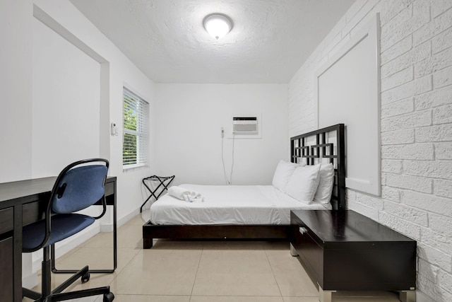 2365 NW 68th St, Miami, FL 33147 - bedroom featuring a textured ceiling, light tile patterned floors, a wall mounted air conditioner, a desk, and baseboards