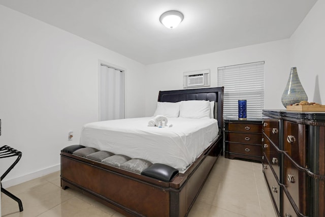 2365 NW 68th St, Miami, FL 33147 - bedroom with light tile patterned floors, a wall unit AC, and baseboards