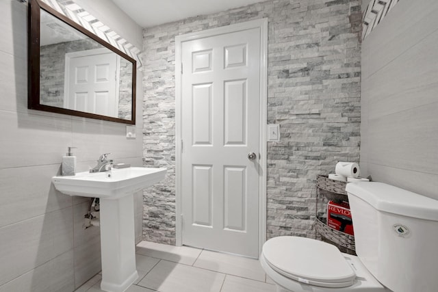 2365 NW 68th St, Miami, FL 33147 - half bathroom with tile patterned flooring and toilet