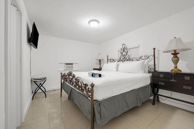 2365 NW 68th St, Miami, FL 33147 - bedroom with a wall unit AC, light tile patterned floors, and baseboards