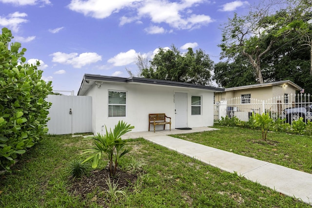 2365 NW 68th St, Miami, FL 33147 - rear view of property with stucco siding