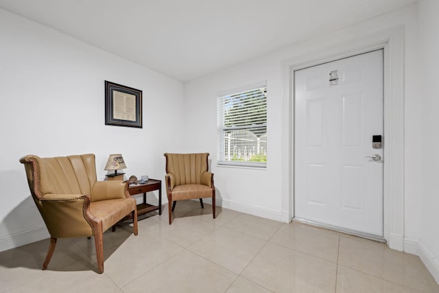 2365 NW 68th St, Miami, FL 33147 - living area featuring baseboards and light tile patterned floors