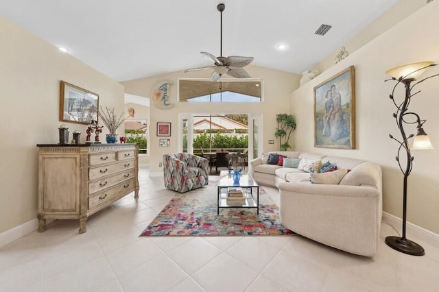 tiled living room featuring ceiling fan and vaulted ceiling