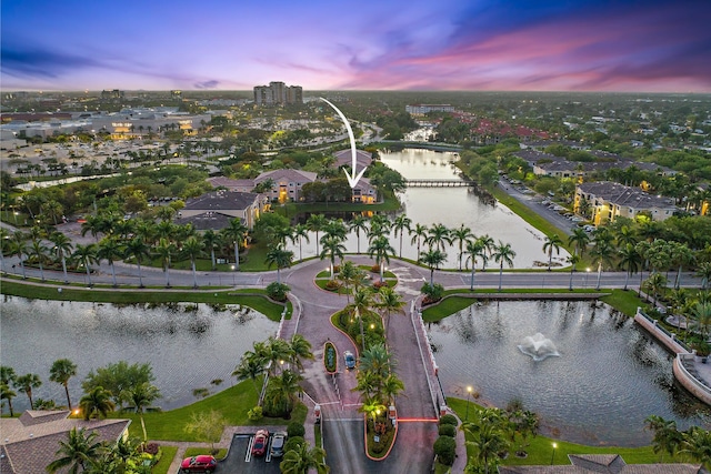 aerial view at dusk with a water view