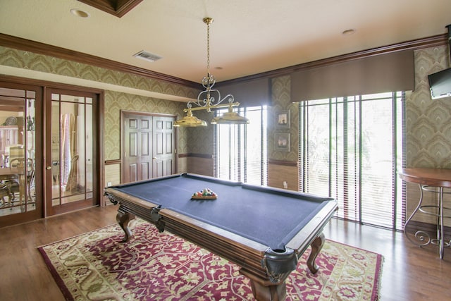 rec room with dark hardwood / wood-style flooring, ornamental molding, and billiards