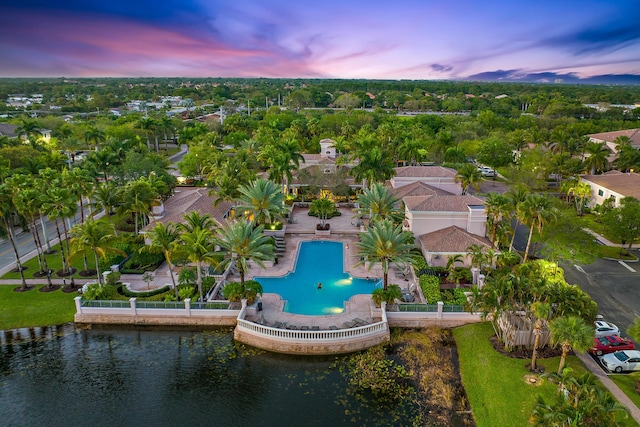 aerial view at dusk with a water view