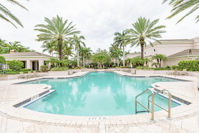 view of swimming pool with a patio area