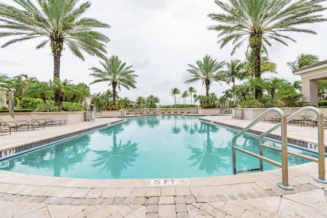 view of swimming pool featuring a patio