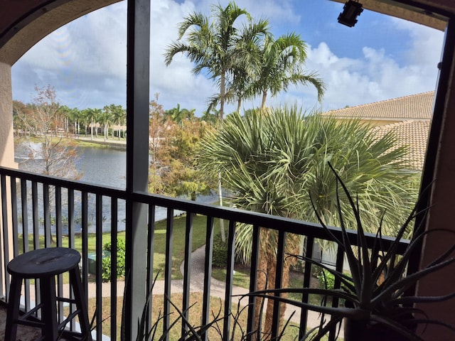 balcony featuring a water view