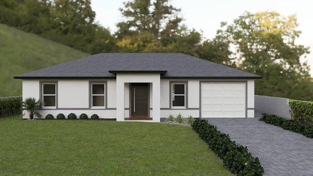 view of front facade with a garage and a front lawn