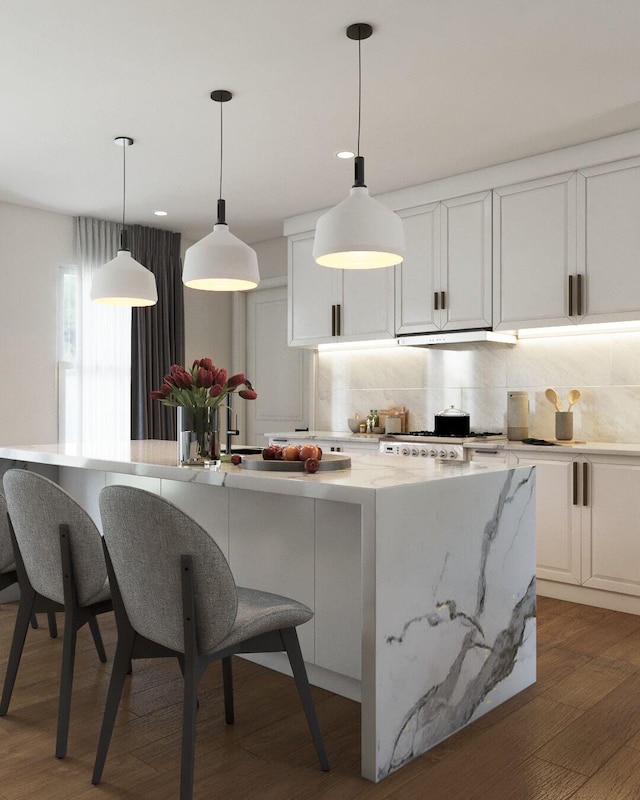 kitchen with light stone countertops, white cabinetry, hanging light fixtures, and dark wood-type flooring