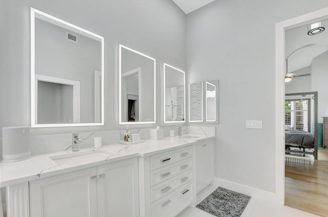 bathroom featuring vanity and hardwood / wood-style flooring