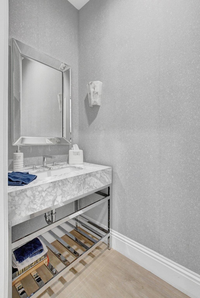 bathroom featuring vanity and wood-type flooring